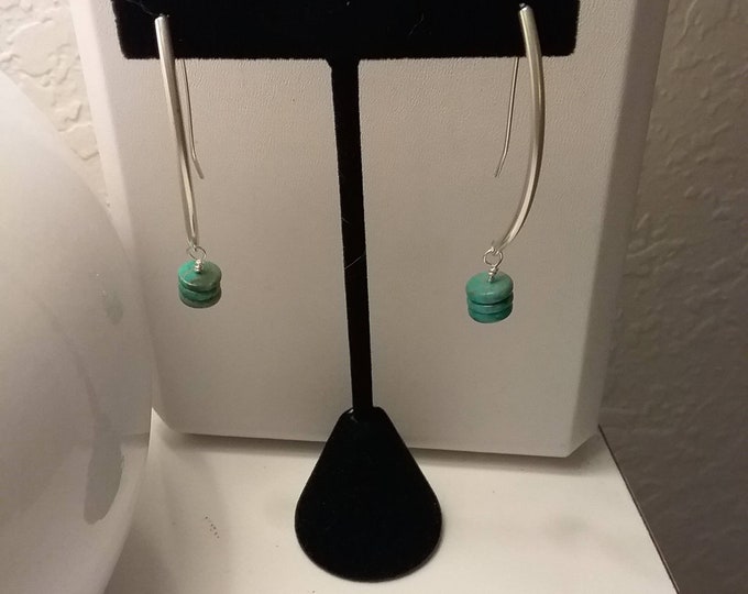 Turquoise disc dangle earrings.  Discs hang from sterling silver tubes with self made earwires. Lightweight,