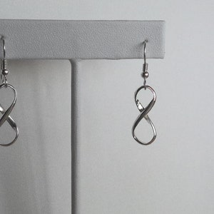 Infinity symbol.  Solid Sterling infinity symbols suspended from sterling silver french earwires