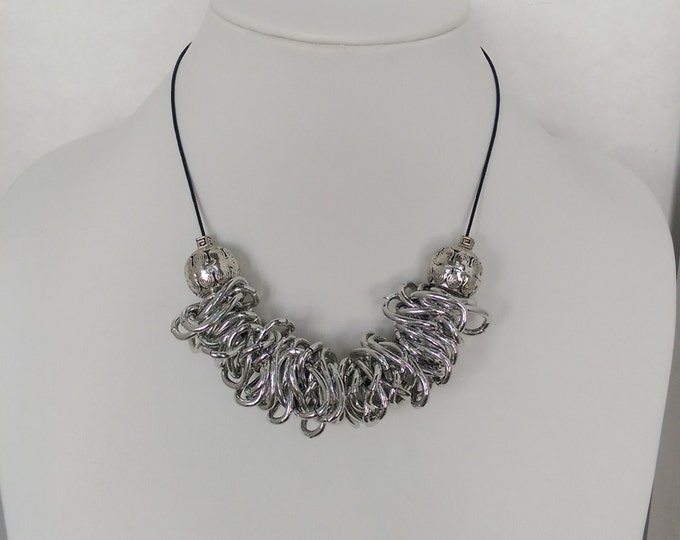 Best seller!  I promise you compliments or your money back!  Loopy Necklace.  Lightweight aluminum links.