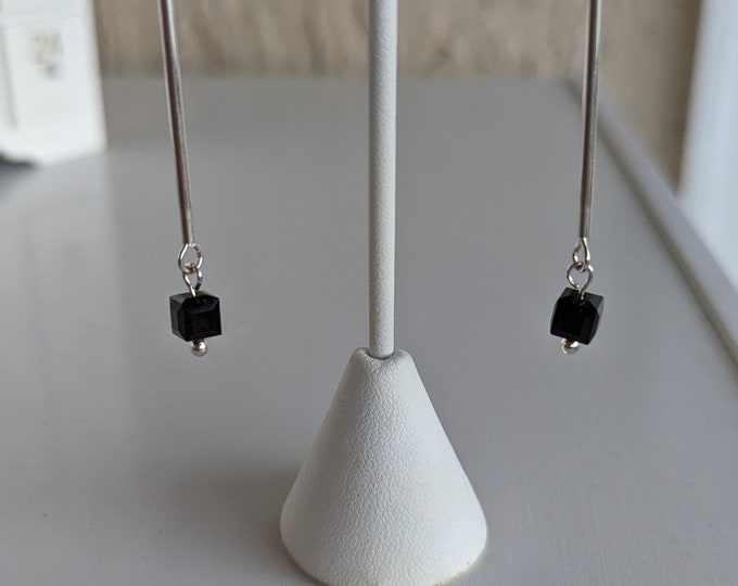 Swarovski crystal black dangles dangles from sterling silver tube on french earwires.