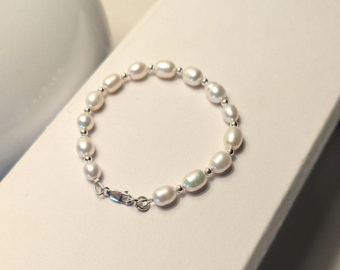 Freshwater pearl and sterling silver bead bracelet!  Lobster claw clasp.  Length 7.5" Loose fit!