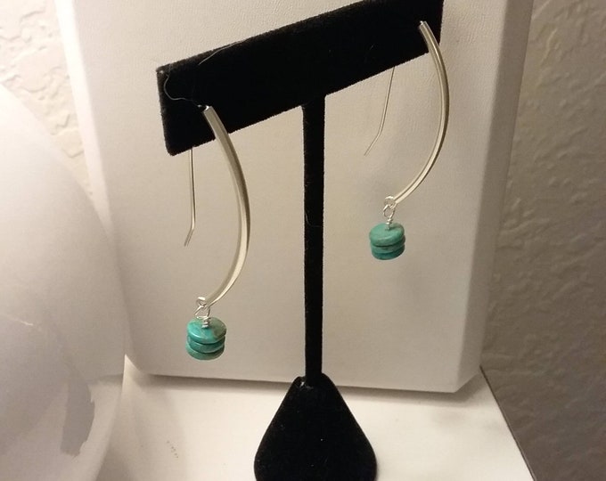 Turquoise disc dangle earrings.  Discs hang from sterling silver tubes with self made earwires. Lightweight,
