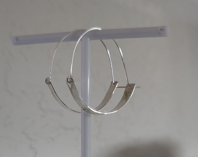 Textured sheet with self wire hangs nicely. All sterling silver.