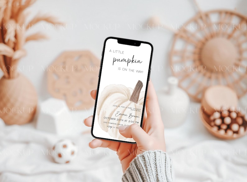 May include: A phone screen displaying a baby shower invitation with a watercolor illustration of a white pumpkin. The invitation reads "A little pumpkin is on the way" and includes the name "Emma Brown" and the date "October 20th at 2:00 PM".
