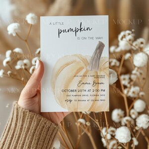 May include: A white card with a watercolor illustration of a pumpkin and the text "A little pumpkin is on the way!"  Join us for a baby shower honoring Emma Brown, October 20th at 2:00 PM, 530 Pumpkin Drive, Florida 3012, RSVP to Briana at 123.456.7890.
