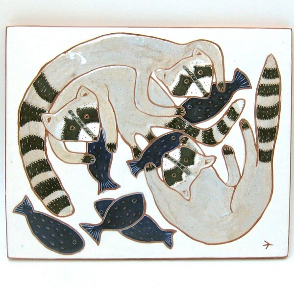 hand carved ceramic art tile snacking raccoons