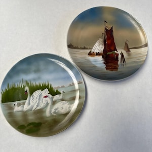 Set of 2 Painted Decorative Plates made by Dutch Artists with Swan, Fishing Boats, Nature, Water