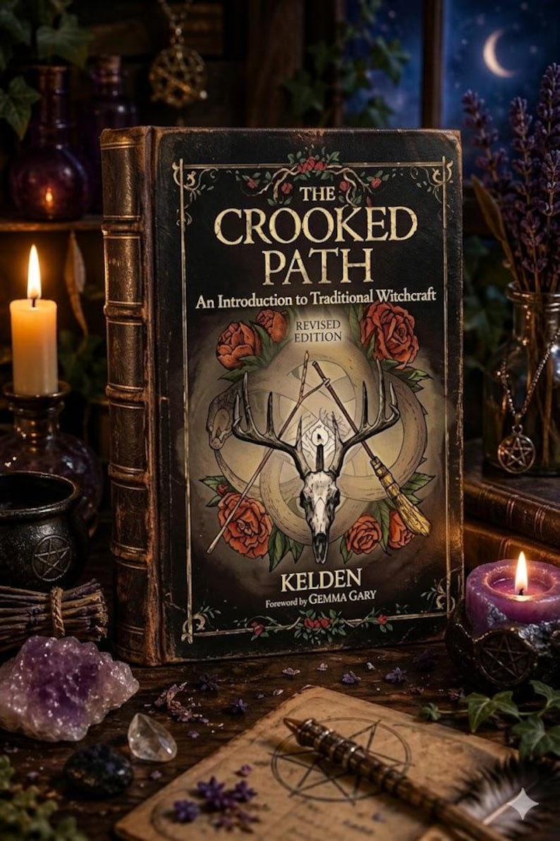 May include: A hardcover book titled "The Crooked Path: An Introduction to Traditional Witchcraft" with a deer skull and rose illustration. The book is surrounded by candles, crystals, and other mystical items, creating a witchy aesthetic.