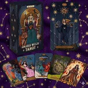 May include: A tarot card deck titled "Sacred Witch Tarot" with a box featuring a seated woman with a tiger and deer. Several tarot cards are displayed, showcasing detailed illustrations in shades of blue, green, and orange. The cards have gold accents and celestial imagery.