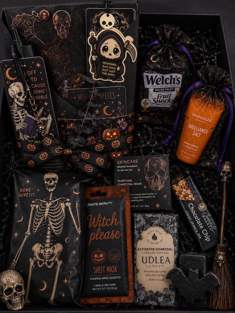 May include: A gift box containing a skeleton-themed bookmark, a grim reaper charm, Welch's fruit snacks, Spongelle hand cream, a charcoal mask, a Witch Please pumpkin spice sheet mask, an Udlea charcoal bath bar, a chocolate chip granola bar, and a skull.