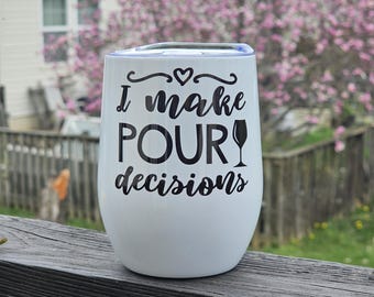 May include: White stainless steel wine tumbler with a black design that says "I make pour decisions" and a small wine glass icon.