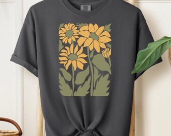 May include: A dark gray t-shirt with a graphic print of stylized sunflowers in yellow and green.