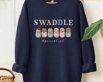 Swaddle Specialist Sweatshirt, Labor And Delivery Nurse Crewneck, NICU Nurse Gift, Postpartum Unit Shirt, Mother Baby Nurse Sweater