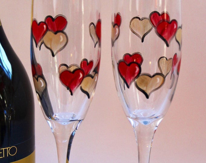 Wedding toasting champagne flutes with hand painted hearts.  Anniversary glasses. Can be personalized. Made in the USA