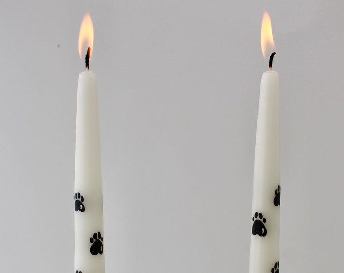 Paw print hand painted taper candles.  12 inch cotton wick.  Slow burning.  Made in USA.