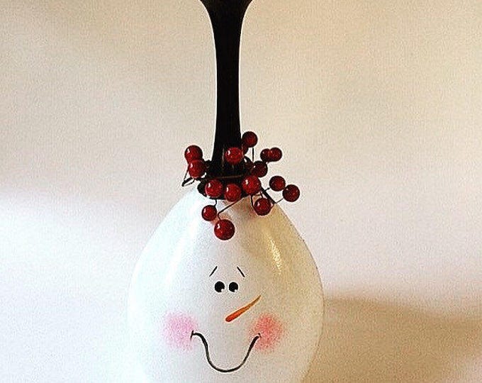 Snowman hand painted wine glass tea light holder. Lead free and made in the USA.