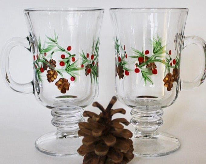 Christmas Irish coffee mugs pair- hand painted glass.  Pine cones and winter berries- footed mugs- gift for her- holiday decor.