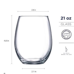 May include: A clear, stemless wine glass with a 21 oz capacity. The glass is 4.8 inches tall, 2.8 inches wide, and 2.1 inches in diameter. The image includes text that says "GLASS", "DISHWASHER SAFE", and "GLASS MADE IN USA".