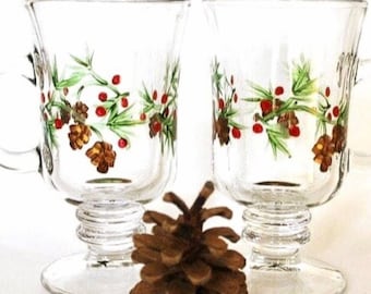 Christmas Irish coffee mugs pair- hand painted glass.  Pine cones and winter berries- footed mugs- gift for her- holiday decor.