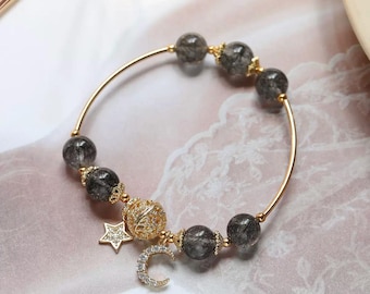 Bracelet cheveux noirs perles, cristal, breloque étoile de lune, plaqué or