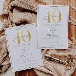 May include: Two gold and white wedding anniversary invitations with gold foil accents. The invitations announce the celebration of 40 years of marriage for Sarah and William. The invitations include the date, time, and location of the event. RSVP information is also included.