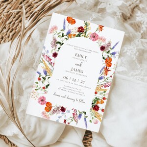 May include: A wedding invitation with a floral border. The invitation is for Emily Grace Jones and James Michael Anderson. The wedding is on June 14, 2025, at 4 o'clock in the afternoon at Sandstone Estate, 145 Melrose Avenue, Ashton, Massachusetts. Dinner and dancing to follow.
