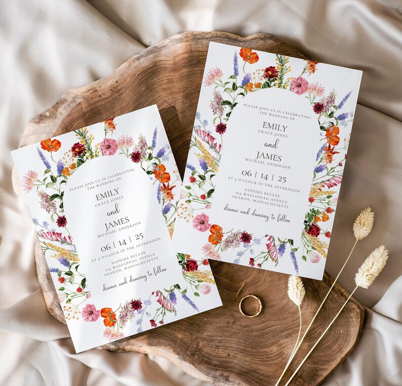 May include: Wedding invitation with a floral design featuring a wreath of wildflowers in shades of pink, purple, orange, and red. The text reads "Please join us in celebrating the wedding of Emily Grace Jones and James Michael Anderson 06 | 14 | 25 at o'clock in the afternoon Sapphias Estate Sharon, Massachusetts dinner and dancing to follow"