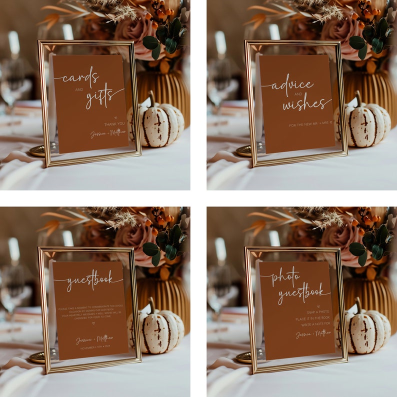 May include: Four gold-framed signs with brown cardstock inserts. The signs are labeled "cards and gifts", "advice and wishes", "guestbook", and "photo guestbook". Each sign has a handwritten font and the text "JM" at the bottom.