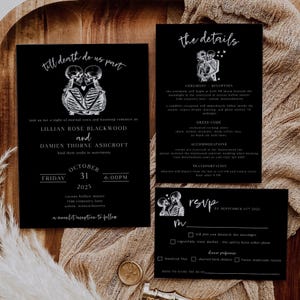 May include: Black wedding invitation suite with a skeleton couple graphic. The invitation includes event details: Lillian Rose Blackwood and Damien Thorne Ashcroft's wedding on October 31, 2025. RSVP card included.