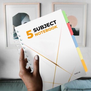 May include: A white notebook with a gold geometric design and the text "5 Subject Notebook". The notebook has five coloured tabs on the side.