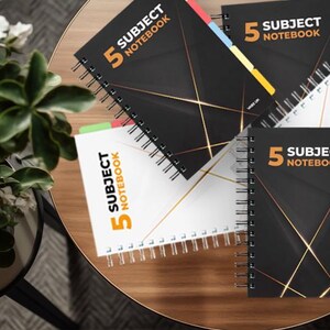 May include: Five subject notebooks with colourful tabs. The notebooks have a black cover with gold lines and the text "5 Subject Notebook" in white and orange.