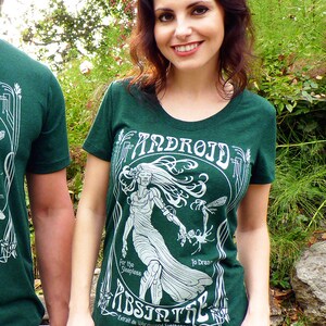 May include: Green t-shirt with a white graphic design featuring the word "ANDROID" and the word "ABSINTHE". The design includes an illustration of a woman and the text "For the Sleepless To Dream".