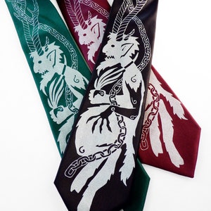 May include: Three neckties in shades of green, burgundy, and black, each featuring a silver mythical creature design. The ties are arranged diagonally, showcasing the intricate details of the artwork. The ties are made of a smooth, shiny material.