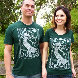 May include: Two people wearing matching dark green t-shirts with a white graphic design. The design includes the word "ANDROID", a woman, and the word "ABSINTH". The shirts are paired with blue jeans.