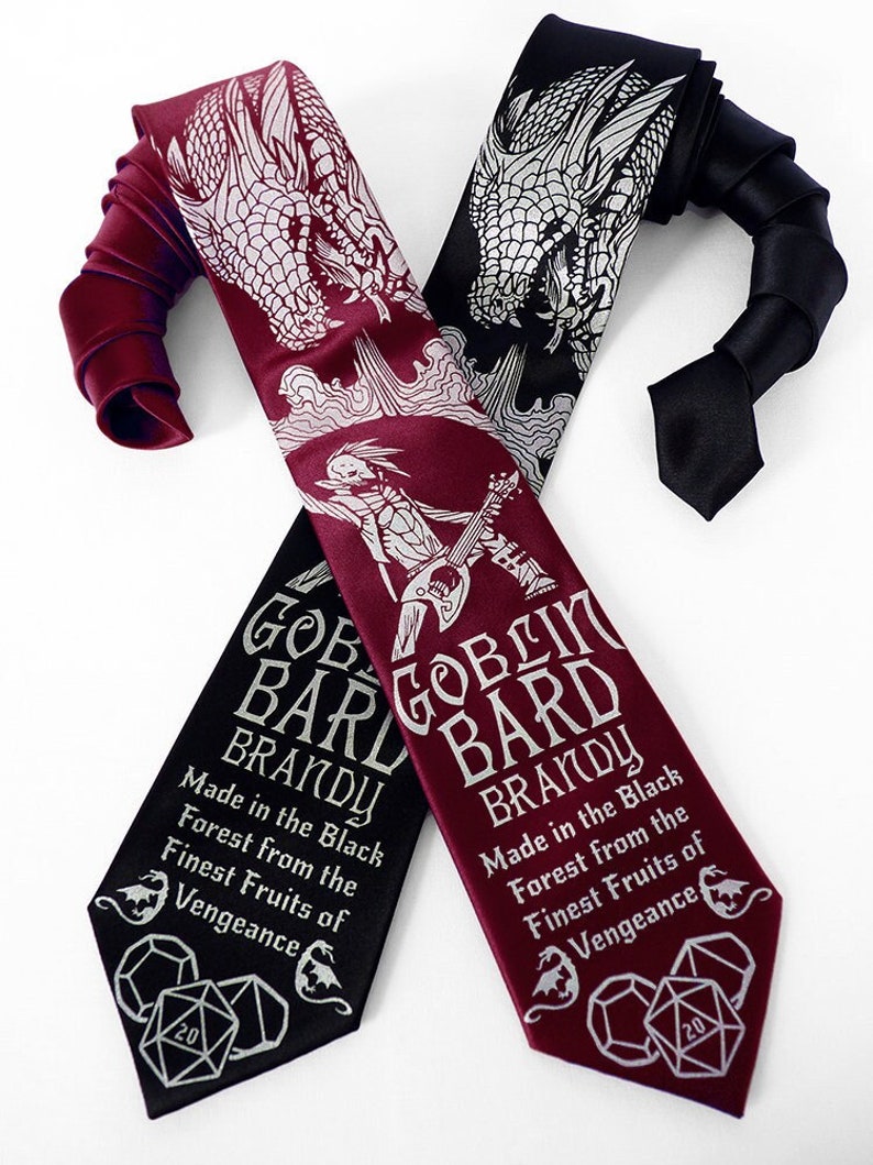 May include: Two black and burgundy neckties with a dragon and a goblin bard design. The text on the ties reads "Goblin Bard Brandy" and "Made in the Black Forest from the Finest Fruits of Vengeance".