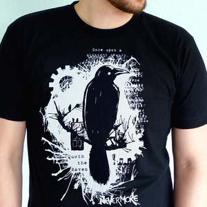 May include: Black t-shirt with a white graphic design featuring a raven, a gear, and the text "Once upon a midnight dreary... Quoth the Raven Nevermore".