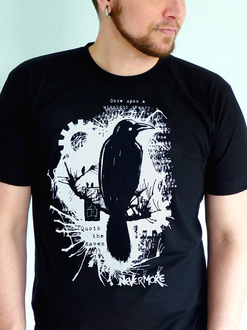 May include: Black t-shirt with a white graphic design featuring a raven, a gear, and the text "Once upon a midnight dreary... Quoth the Raven Nevermore".