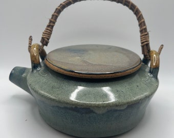 handmade ceramic teapot with bamboo handle