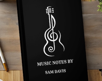Cuaderno de notas con líneas blancas y negras para guitarrista
