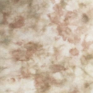 May include: A close-up of a fabric with a tie-dye pattern in shades of brown, beige, and white.