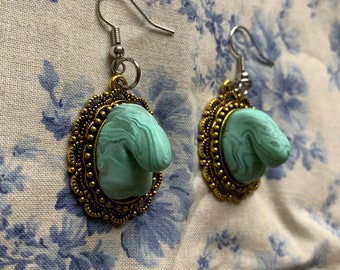 Hand sculpted mint green and translucent swirl penis earrings