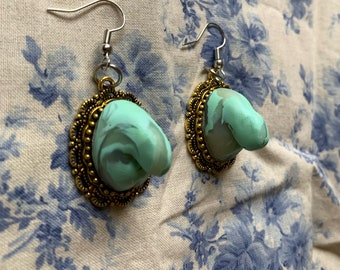 Hand sculpted mint green and translucent swirl penis earrings