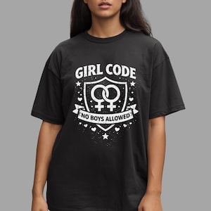 May include: Black t-shirt with a white graphic that reads "GIRL CODE" above a shield design with two female symbols and the text "NO BOYS ALLOWED". The design includes stars and hearts.