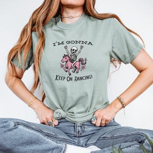 Vintage Pink Pony Skeleton T-Shirt: Fun Halloween Graphic Tee