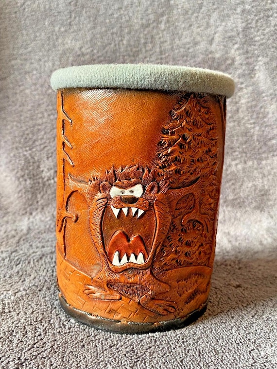 Genuine leather pen/cup holder with hand-tooled carving and shading — the kind of heirloom desk piece that makes an IKEA setup look ashamed.