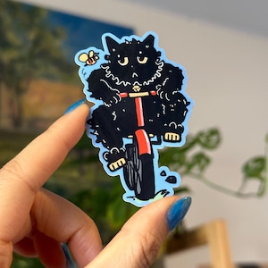 Pegatina de vinilo brillante resistente al agua con diseño de gato negro gracioso y tonto en bicicleta para portátil, botella de agua, agenda, gatito, animal, regalo para amantes de los gatos