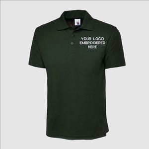 May include: A dark green polo shirt with a white embroidered logo that says "YOUR LOGO EMBROIDERED HERE".