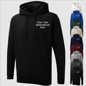 May include: Black hooded sweatshirt with white embroidered text that says "Your Text Embroidered here". The sweatshirt is shown with a variety of colour options.