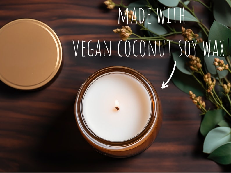 May include: A lit candle in a brown glass jar with a gold lid. The candle is made with vegan coconut soy wax. The text "MADE WITH VEGAN COCONUT SOY WAX" is written in white above the candle.