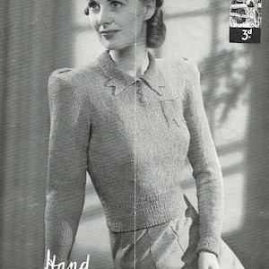May include: A black and white photo of a woman wearing a knitted sweater with a collar. The sweater has puffed shoulders and is made of a textured yarn. The text "Hand Knitwear in Poplar Boucle" is written below the woman. The image is from a vintage knitting pattern.